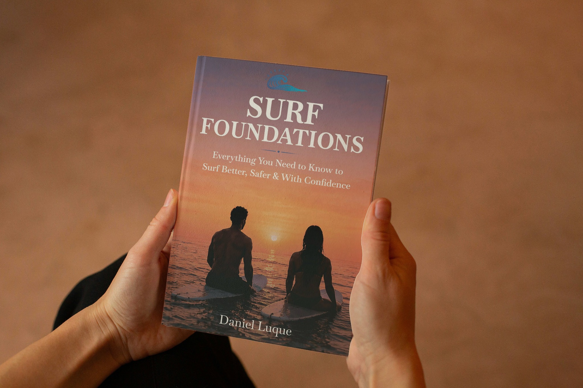 Surf Foundations book held in two hands