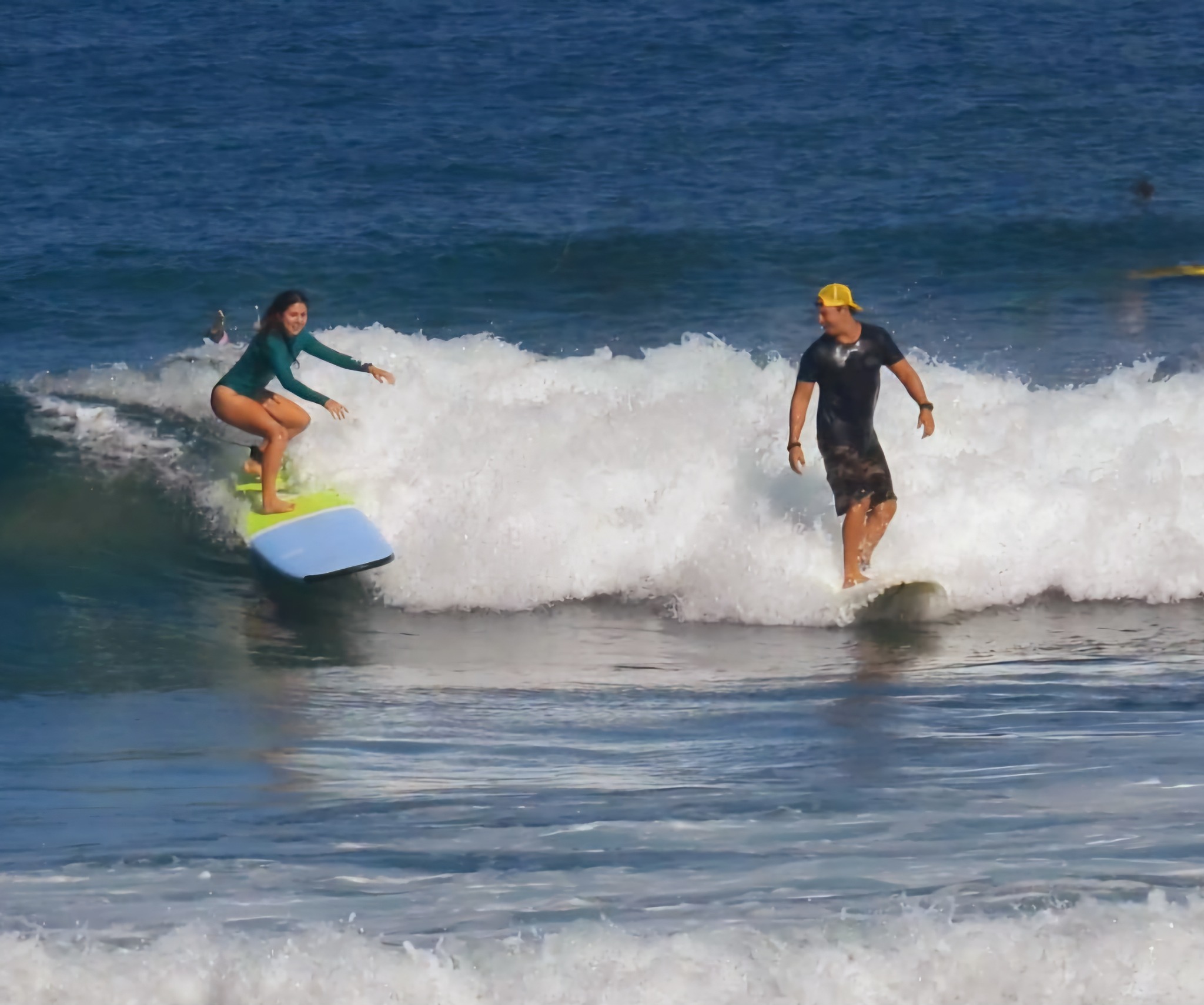 Daniel coaching a surfer during an ocean session