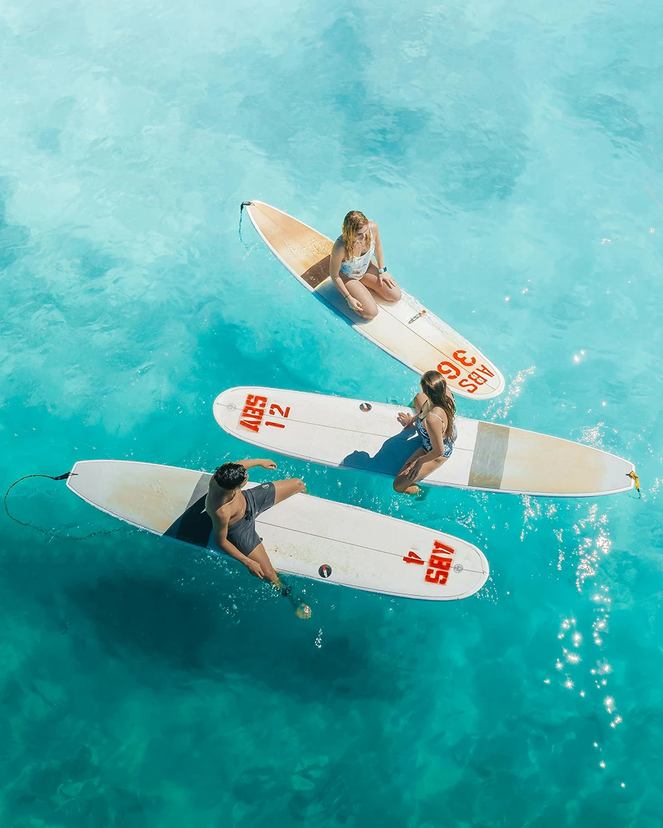Sitting on the surfboards in the sea